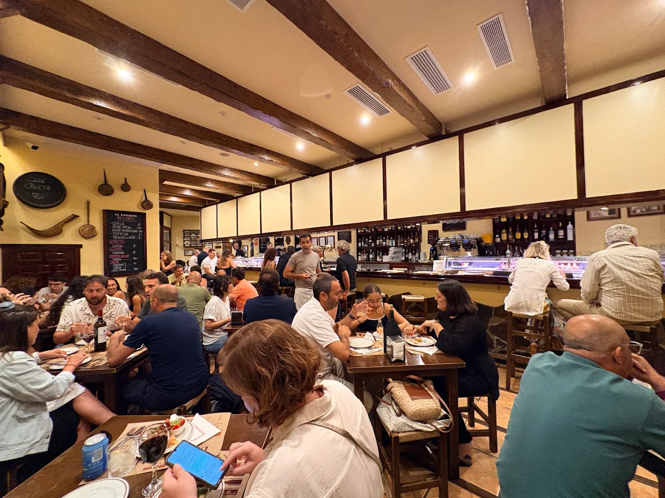 el zaguan 7 Diners seated at tables and the bar inside El Zaguán in Ibiza Town